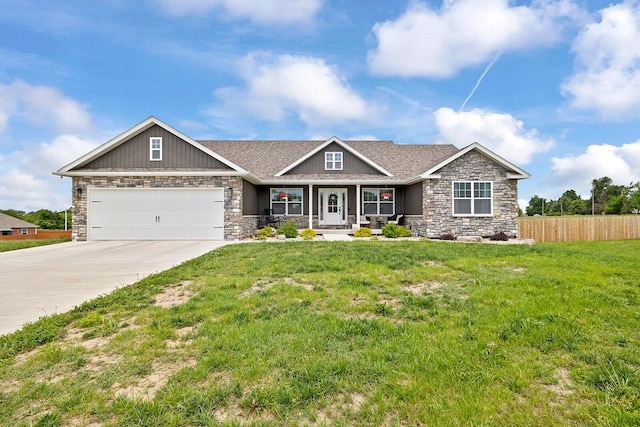2025 Diego Ct, Bolivar, MO 65613 - craftsman inspired home with stone siding, covered porch, concrete driveway, and a garage