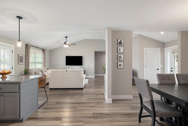 2025 Diego Ct, Bolivar, MO 65613 - dining space with lofted ceiling, baseboards, a ceiling fan, and light wood-type flooring
