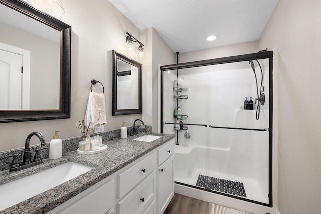 2025 Diego Ct, Bolivar, MO 65613 - full bath with a shower stall, double vanity, and wood finished floors