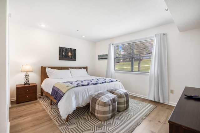128 Bunker Ridge Rd Unit 2, Branson, MO 65616 - bedroom featuring light wood-type flooring, recessed lighting, and baseboards