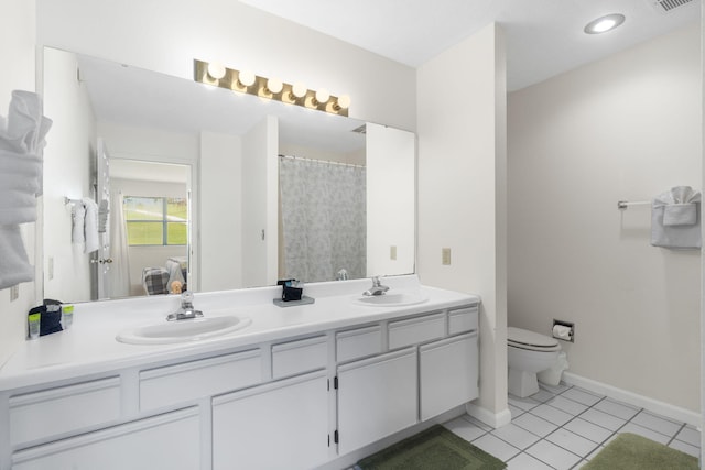 128 Bunker Ridge Rd Unit 2, Branson, MO 65616 - bathroom with double vanity, tile patterned flooring, toilet, and baseboards