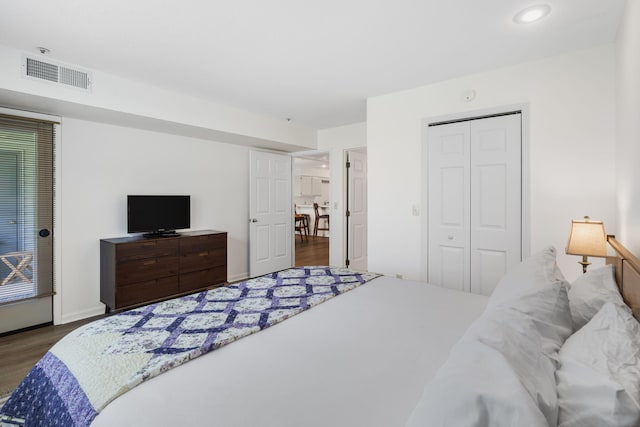 128 Bunker Ridge Rd Unit 2, Branson, MO 65616 - bedroom featuring wood finished floors, a closet, recessed lighting, and baseboards