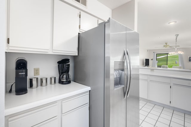 128 Bunker Ridge Rd Unit 2, Branson, MO 65616 - kitchen featuring stainless steel fridge, white cabinets, and light countertops