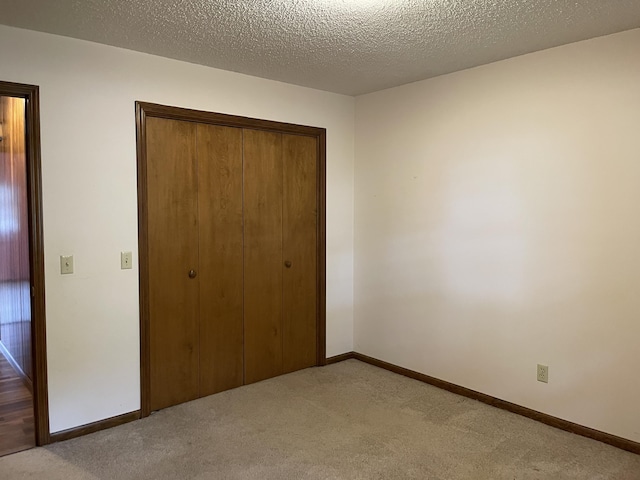 641 N Claud Ave, Bolivar, MO 65613 - unfurnished bedroom with a closet, carpet floors, and baseboards