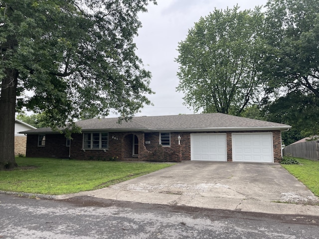 641 N Claud Ave, Bolivar, MO 65613 - ranch-style house featuring an attached garage, driveway, and brick siding