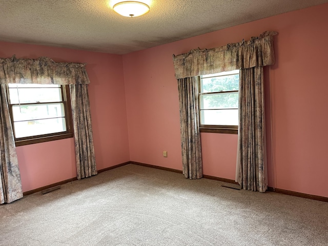 641 N Claud Ave, Bolivar, MO 65613 - empty room with carpet floors, a textured ceiling, and baseboards