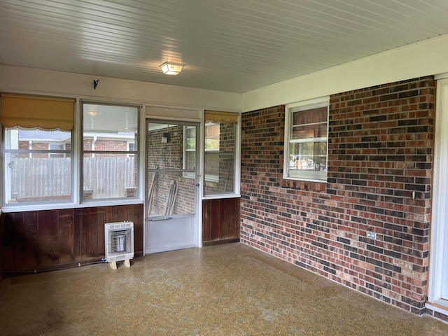 641 N Claud Ave, Bolivar, MO 65613 - unfurnished sunroom with brick wall and heating unit