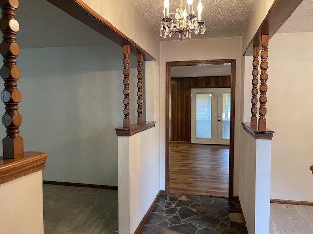 641 N Claud Ave, Bolivar, MO 65613 - corridor featuring a chandelier, a textured ceiling, baseboards, and french doors
