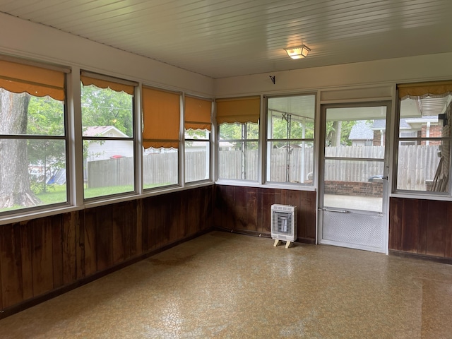 641 N Claud Ave, Bolivar, MO 65613 - unfurnished sunroom with heating unit, healthy amount of natural light, and wooden walls
