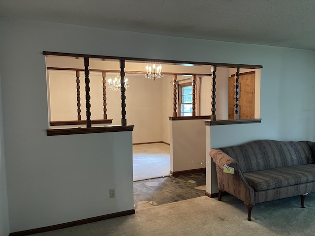 641 N Claud Ave, Bolivar, MO 65613 - carpeted living area with a chandelier and baseboards