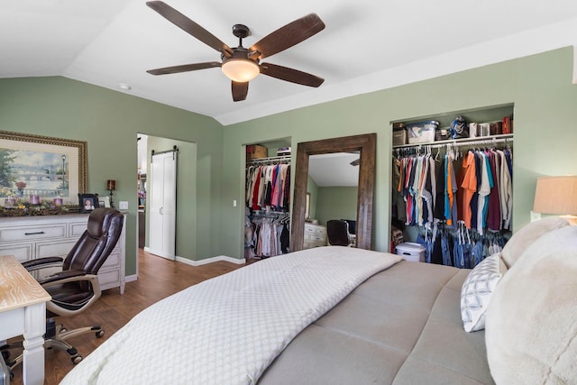 132 Nature Trail Ln, Noel, MO 64854 - bedroom with multiple closets, lofted ceiling, wood finished floors, ceiling fan, and baseboards