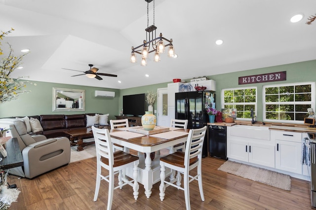 132 Nature Trail Ln, Noel, MO 64854 - dining room with wood finished floors, ceiling fan, a wall unit AC, recessed lighting, and a chandelier
