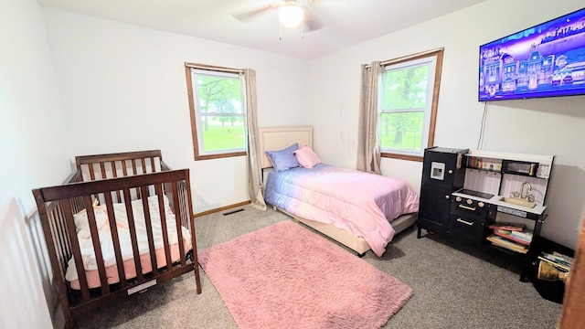 9550 S 325th Rd, El Dorado Springs, MO 64744 - carpeted bedroom with a ceiling fan and baseboards