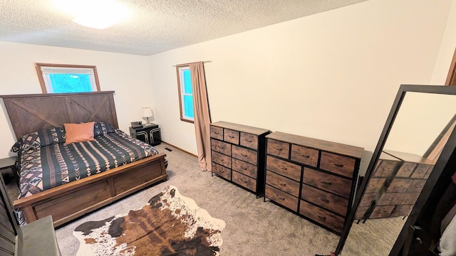9550 S 325th Rd, El Dorado Springs, MO 64744 - carpeted bedroom with a textured ceiling