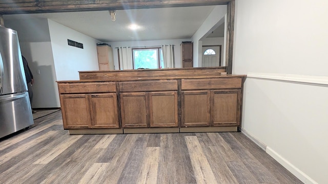 9550 S 325th Rd, El Dorado Springs, MO 64744 - kitchen with freestanding refrigerator, wood finished floors, and baseboards