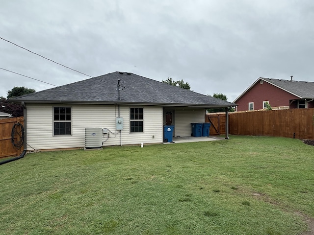 2818 E 16th St, Joplin, MO 64804 - rear view of property with a patio area, cooling unit, and a shingled roof