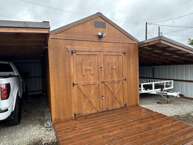 2818 E 16th St, Joplin, MO 64804 - view of shed featuring a carport