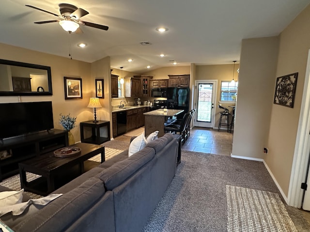 2818 E 16th St, Joplin, MO 64804 - living room featuring a ceiling fan, lofted ceiling, baseboards, recessed lighting, and carpet flooring