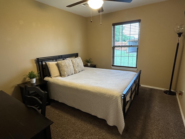 2818 E 16th St, Joplin, MO 64804 - bedroom featuring dark colored carpet, baseboards, and ceiling fan