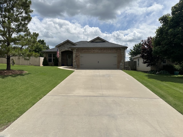 2818 E 16th St, Joplin, MO 64804 - ranch-style home featuring concrete driveway, a garage, brick siding, and a shingled roof