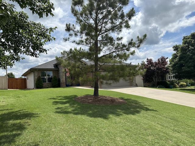 2818 E 16th St, Joplin, MO 64804 - view of front of property with driveway, brick siding, and a garage