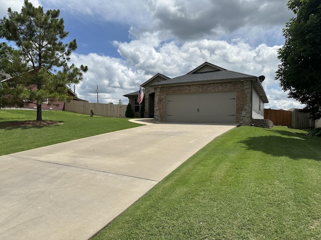 2818 E 16th St, Joplin, MO 64804 - view of front of property featuring brick siding, driveway, and an attached garage