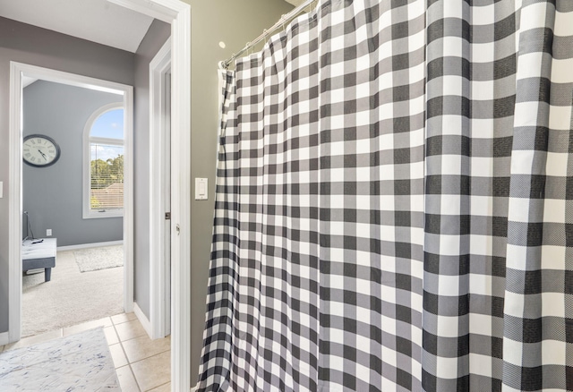 3909 W Eaglecrest St, Battlefield, MO 65619 - full bath with tile patterned flooring, baseboards, and a shower with shower curtain