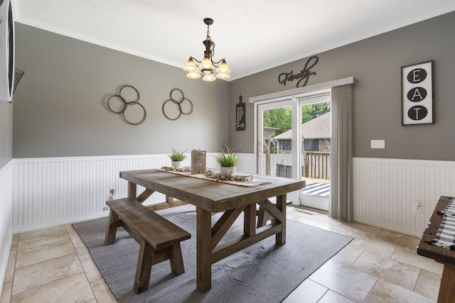 3909 W Eaglecrest St, Battlefield, MO 65619 - dining area with a wainscoted wall, a chandelier, and ornamental molding