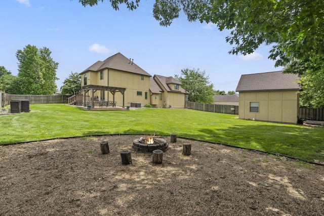 3909 W Eaglecrest St, Battlefield, MO 65619 - rear view of property featuring an outdoor fire pit, a pergola, central AC, and a wooden deck