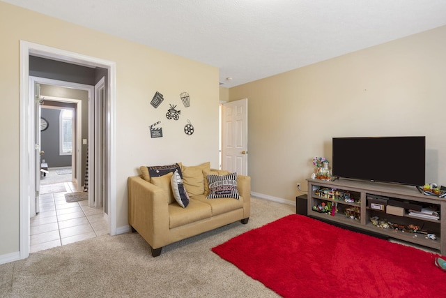 3909 W Eaglecrest St, Battlefield, MO 65619 - carpeted living room featuring baseboards and tile patterned floors