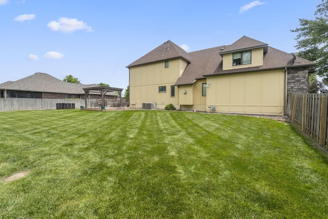 3909 W Eaglecrest St, Battlefield, MO 65619 - back of property featuring a pergola, central AC unit, roof with shingles, and board and batten siding