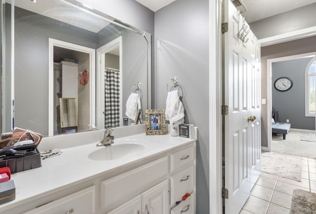 3909 W Eaglecrest St, Battlefield, MO 65619 - ensuite bathroom with vanity and tile patterned floors