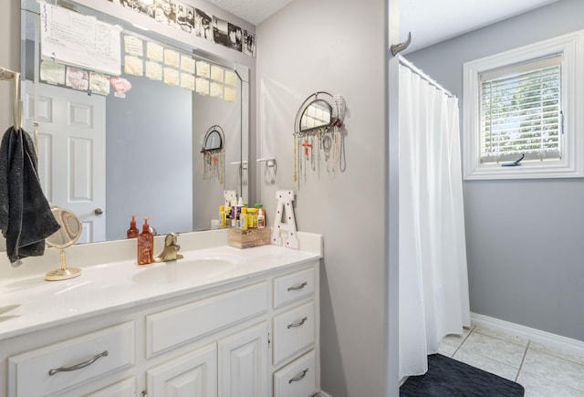 3909 W Eaglecrest St, Battlefield, MO 65619 - bathroom with vanity, tile patterned flooring, baseboards, and curtained shower