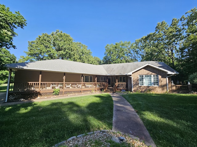 9726 County Road 8530, West Plains, MO 65775 - ranch-style home featuring a front lawn, a wooden deck, and brick siding