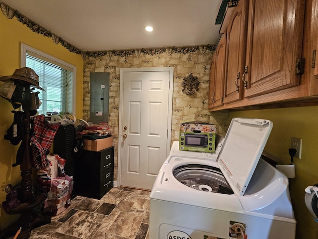 9726 County Road 8530, West Plains, MO 65775 - laundry room featuring electric panel, washing machine and dryer, and cabinet space