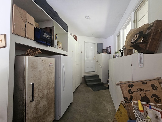 9726 County Road 8530, West Plains, MO 65775 - kitchen featuring freestanding refrigerator and unfinished concrete flooring