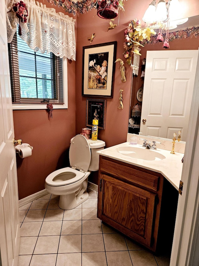 9726 County Road 8530, West Plains, MO 65775 - bathroom featuring vanity, toilet, tile patterned floors, and a chandelier