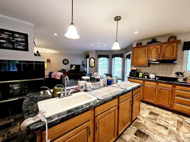 9726 County Road 8530, West Plains, MO 65775 - kitchen with a sink, under cabinet range hood, backsplash, hanging light fixtures, and recessed lighting