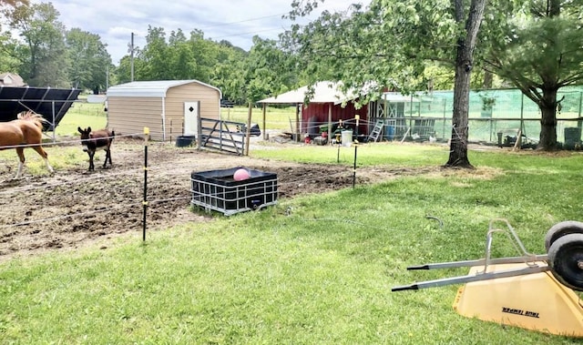 160 Clark St, Taneyville, MO 65759 - view of yard with an outbuilding and an exterior structure
