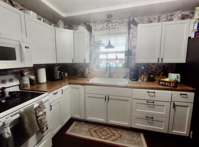 160 Clark St, Taneyville, MO 65759 - kitchen featuring white appliances, a sink, crown molding, decorative backsplash, and white cabinets