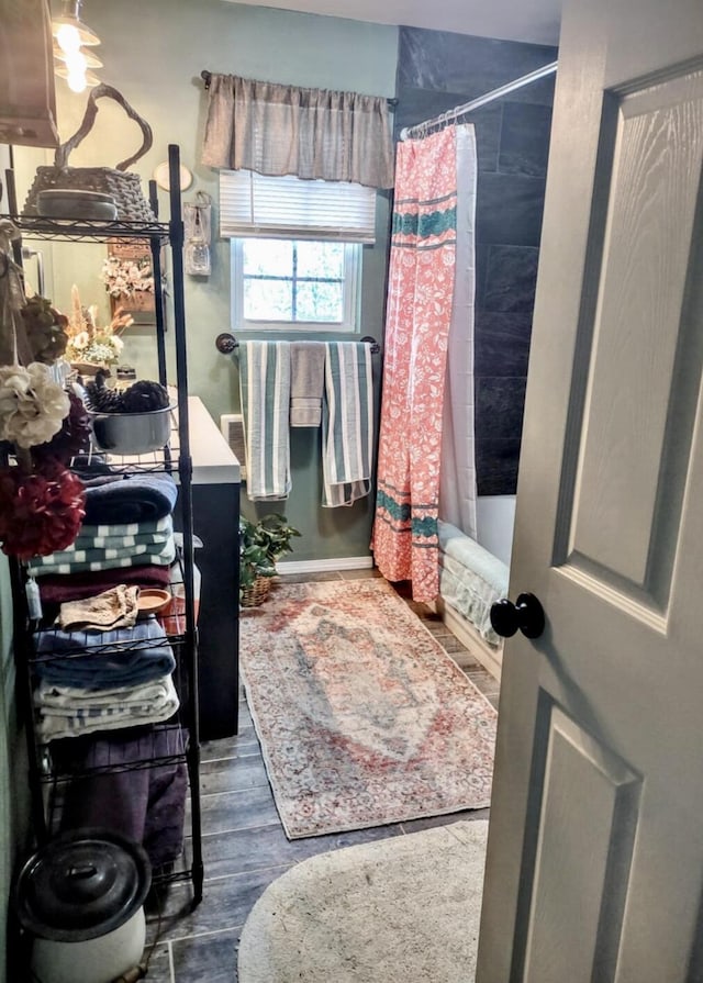 160 Clark St, Taneyville, MO 65759 - full bathroom featuring wood finished floors, shower / bath combo with shower curtain, and vanity