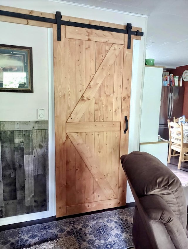 160 Clark St, Taneyville, MO 65759 - detailed view of a barn door, freestanding refrigerator, and wooden walls