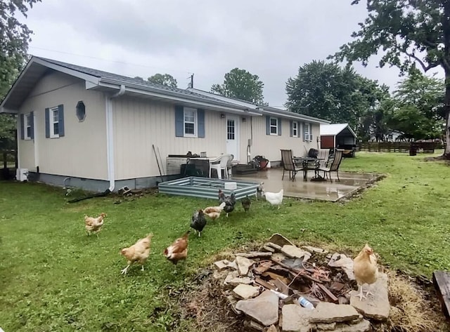 160 Clark St, Taneyville, MO 65759 - back of property featuring a lawn and a patio area