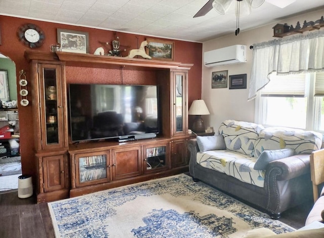 160 Clark St, Taneyville, MO 65759 - living area featuring a wall mounted air conditioner, a ceiling fan, and wood finished floors