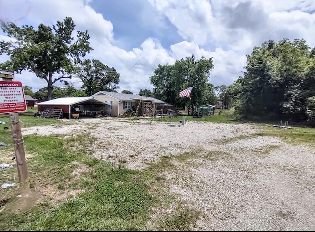 160 Clark St, Taneyville, MO 65759 - view of yard featuring a carport