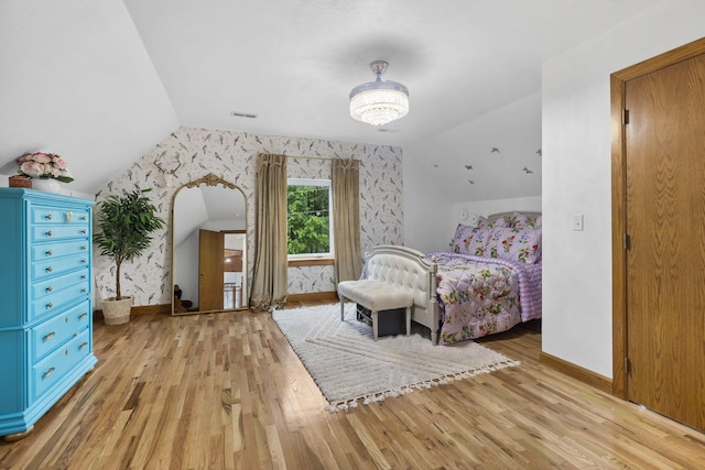 95 Highland Ct, Strafford, MO 65757 - bedroom with lofted ceiling, baseboards, light wood-style flooring, and wallpapered walls