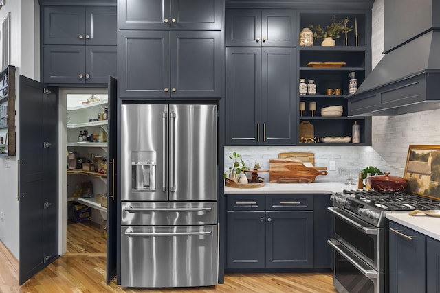 95 Highland Ct, Strafford, MO 65757 - kitchen featuring stainless steel appliances, open shelves, light countertops, and light wood-type flooring