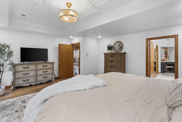 95 Highland Ct, Strafford, MO 65757 - bedroom with wood finished floors, a raised ceiling, and a chandelier