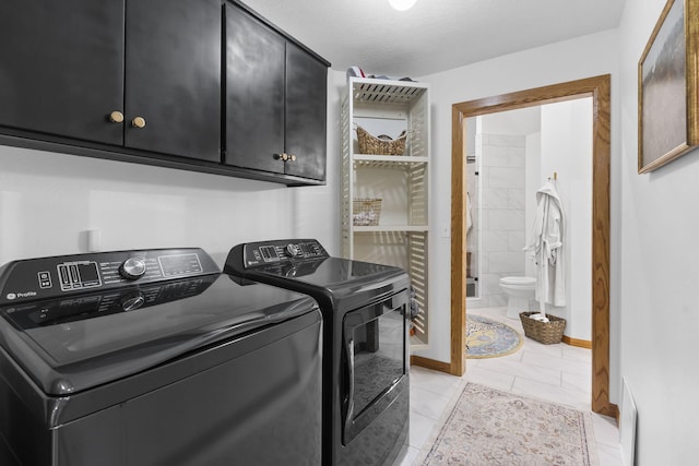95 Highland Ct, Strafford, MO 65757 - washroom featuring cabinet space, independent washer and dryer, light tile patterned floors, and baseboards