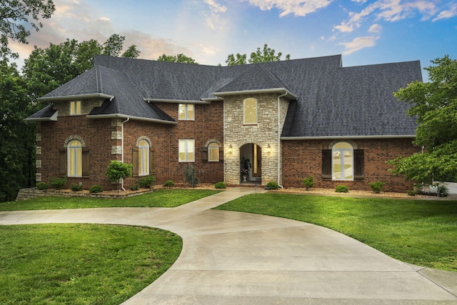 95 Highland Ct, Strafford, MO 65757 - french provincial home with a front yard, a shingled roof, and stone siding